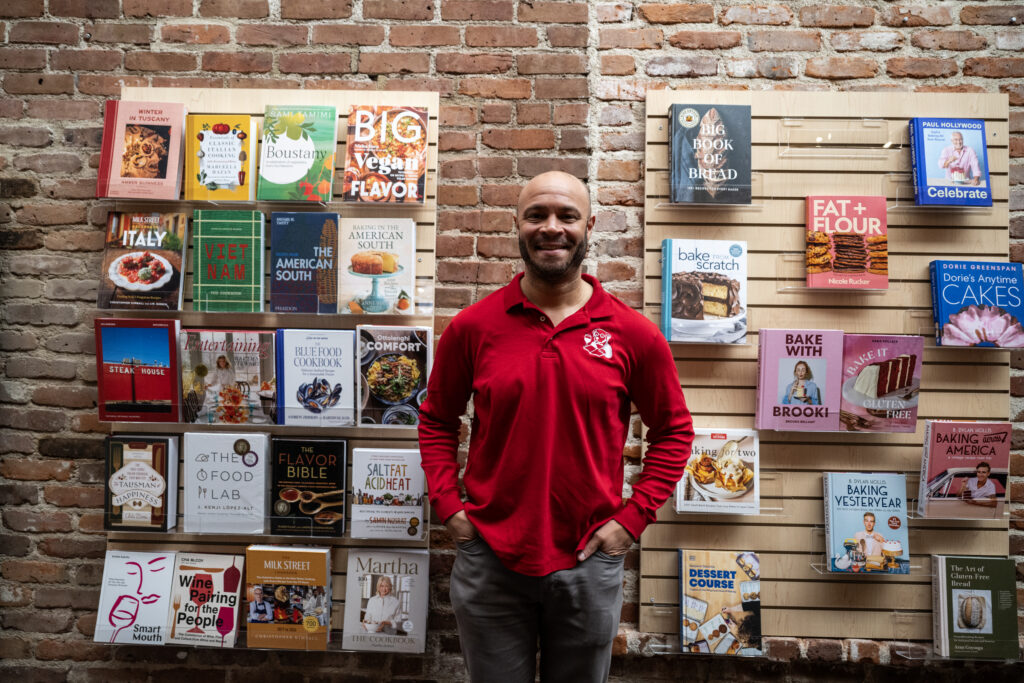 Denver Gazette Kwame Spearman, co-owner of the Denver Book Society, talks with reporters in the new store in downtown Denver during a sneak peek for the new book store on Thursday, Feb. 19, 2026.