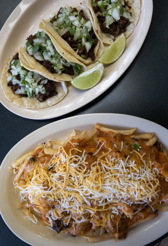 Tacos and smothered fries at Panadería Emmanuel in the Globeville neighborhood in Denver on Tuesday, Feb. 24, 2026. (The Gazette, Christian Murdock)