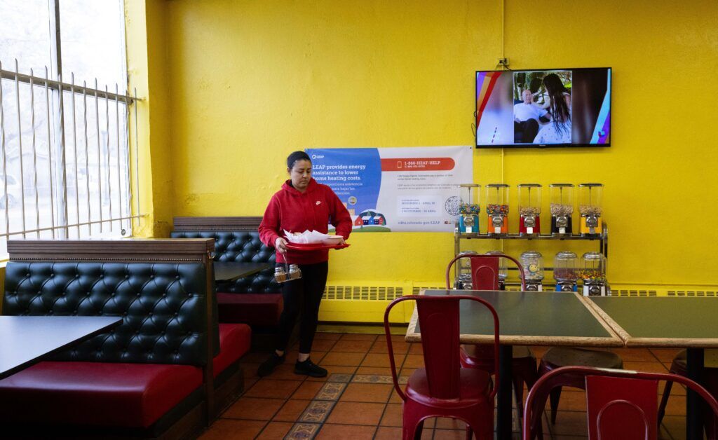 Julia Casillas buses a table after lunch at Panadería Emmanuel in Globeville on Tuesday, Feb. 24, 2026. (The Gazette, Christian Murdock)
