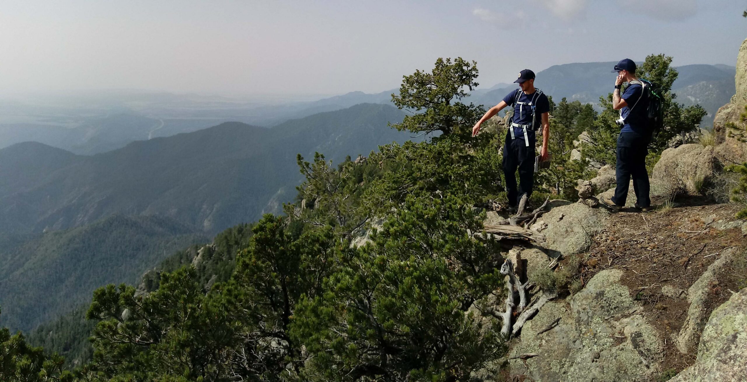 In this file photo, Cheyenne Mountain State Park rangers take in the view from Dragon's Backbone, reached after the long hike up Dixon Trail. Photo by Seth Boster, The Gazette