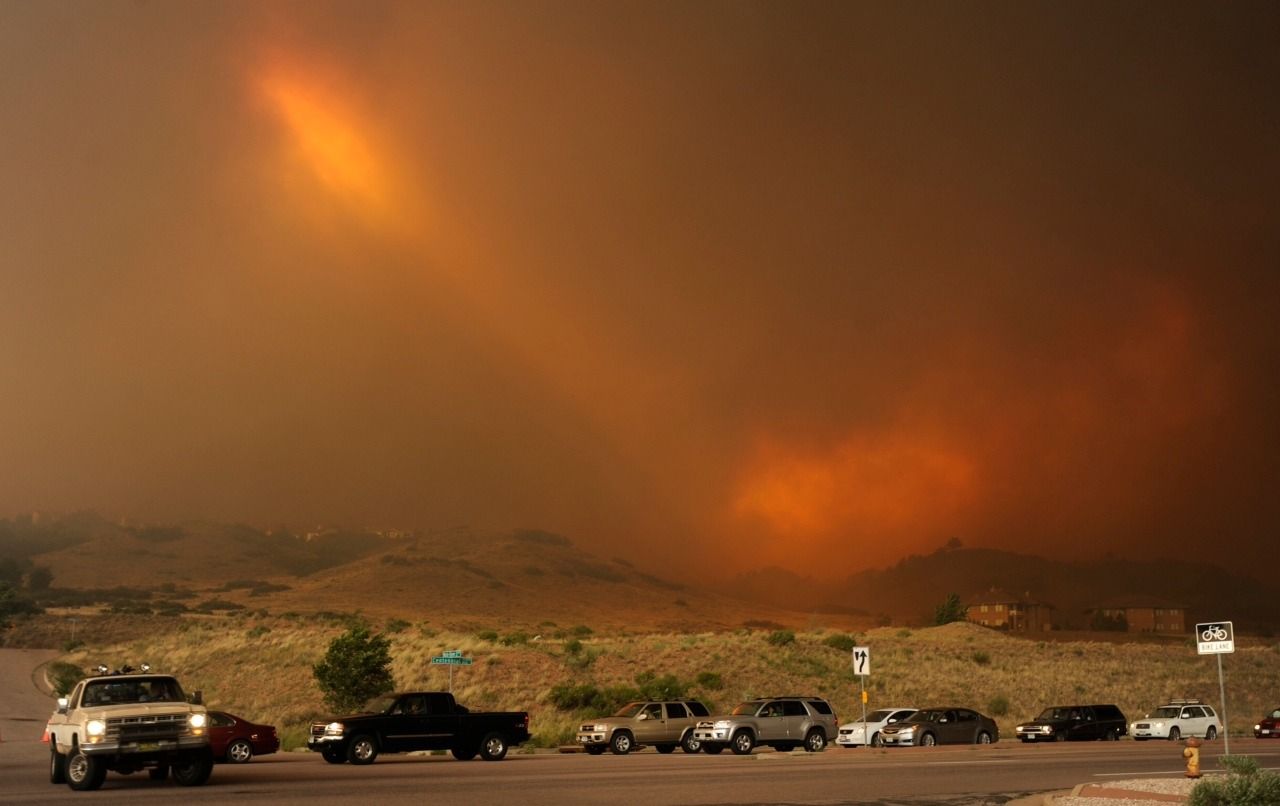 People try to get out of the evacuation area near Mountain Shadows along Centennial Boulevard as the the Waldo Canyon fire burns June 26, 2012.