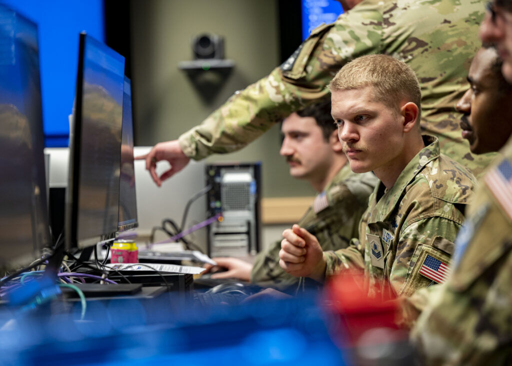 A Space Force guardian looks at his computer screen.