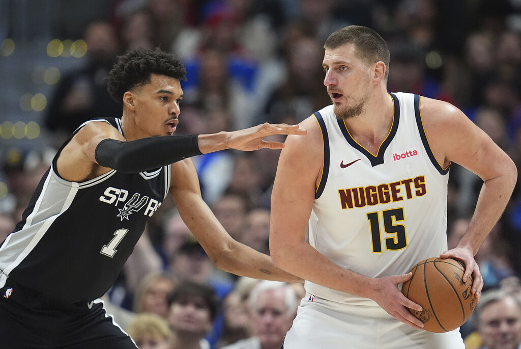 San Antonio Spurs center Victor Wembanyama (1) and Denver Nuggets center Nikola Jokic (15) in the second half of an NBA basketball game Friday, Jan. 3, 2025, in Denver.