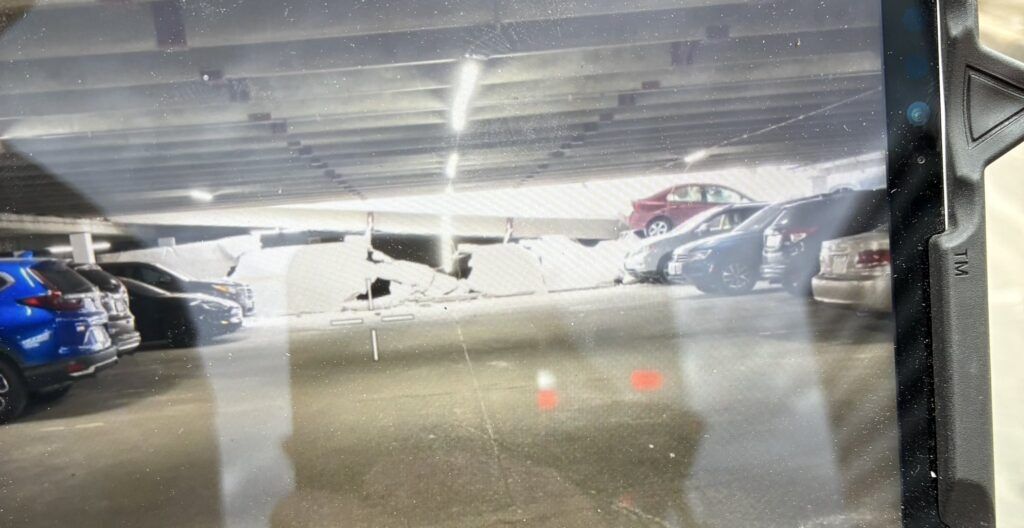 A photo of a collapsed parking garage
