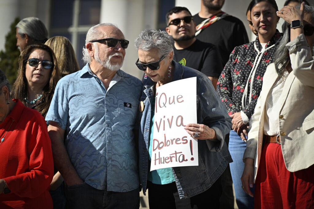 people gather at a city government building