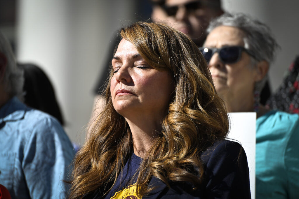 a woman with closed eyes