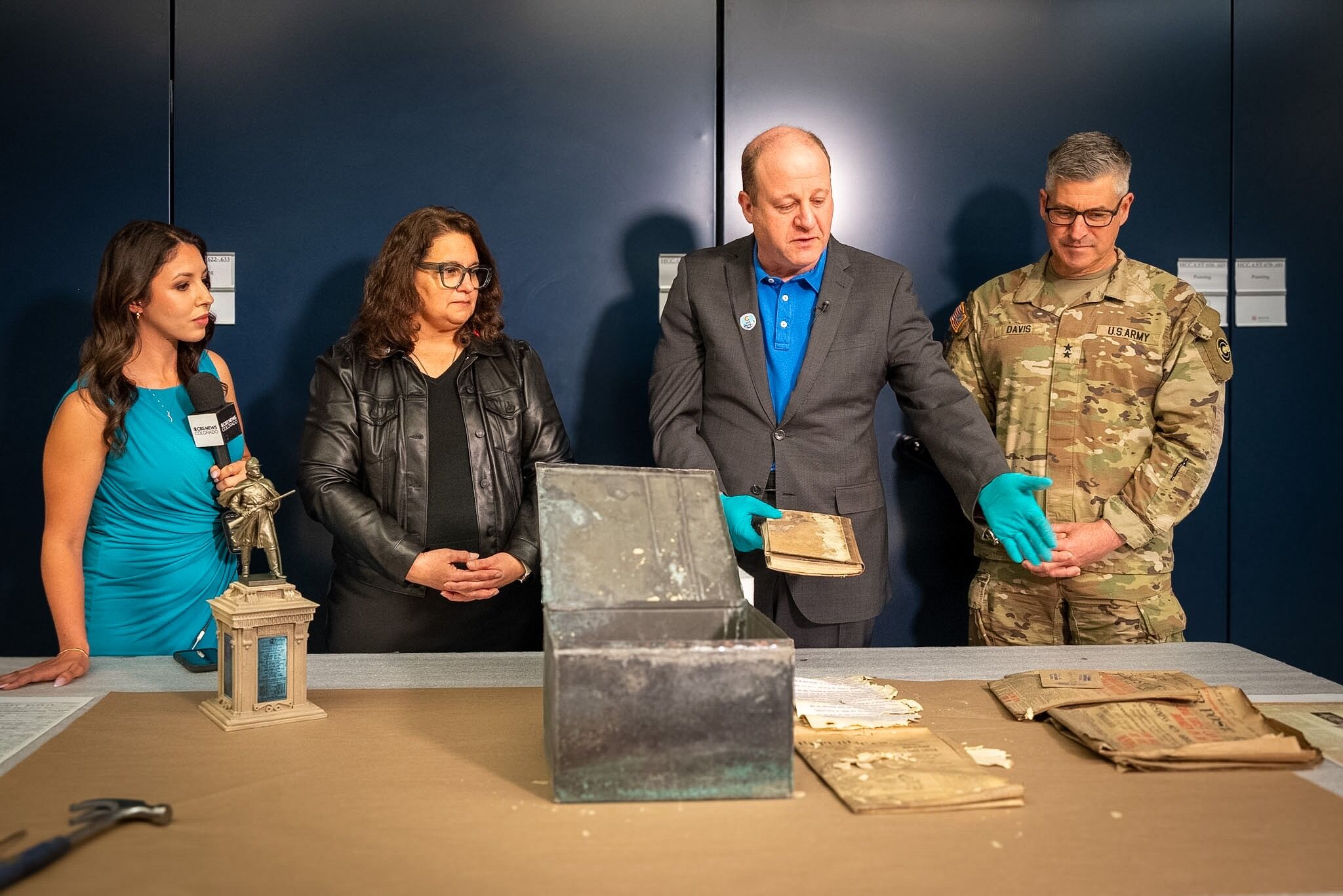 Polis, historians open 20th century time capsule discovered near Colorado’s Capitol steps