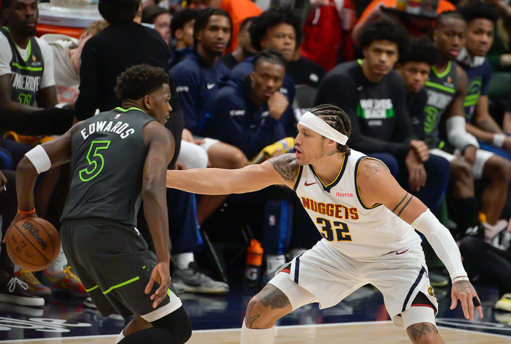 Denver Nuggets forward Aaron Gordon (32) defends Minnesota Timberwolves guard Anthony Edwards (5) in the second half of the first game of the first round of the NBA Championships at Ball Arena on Saturday, April 18, 2026. The Nuggets defeated the Timberwolves 116-105. (The Gazette, Jerilee Bennett)