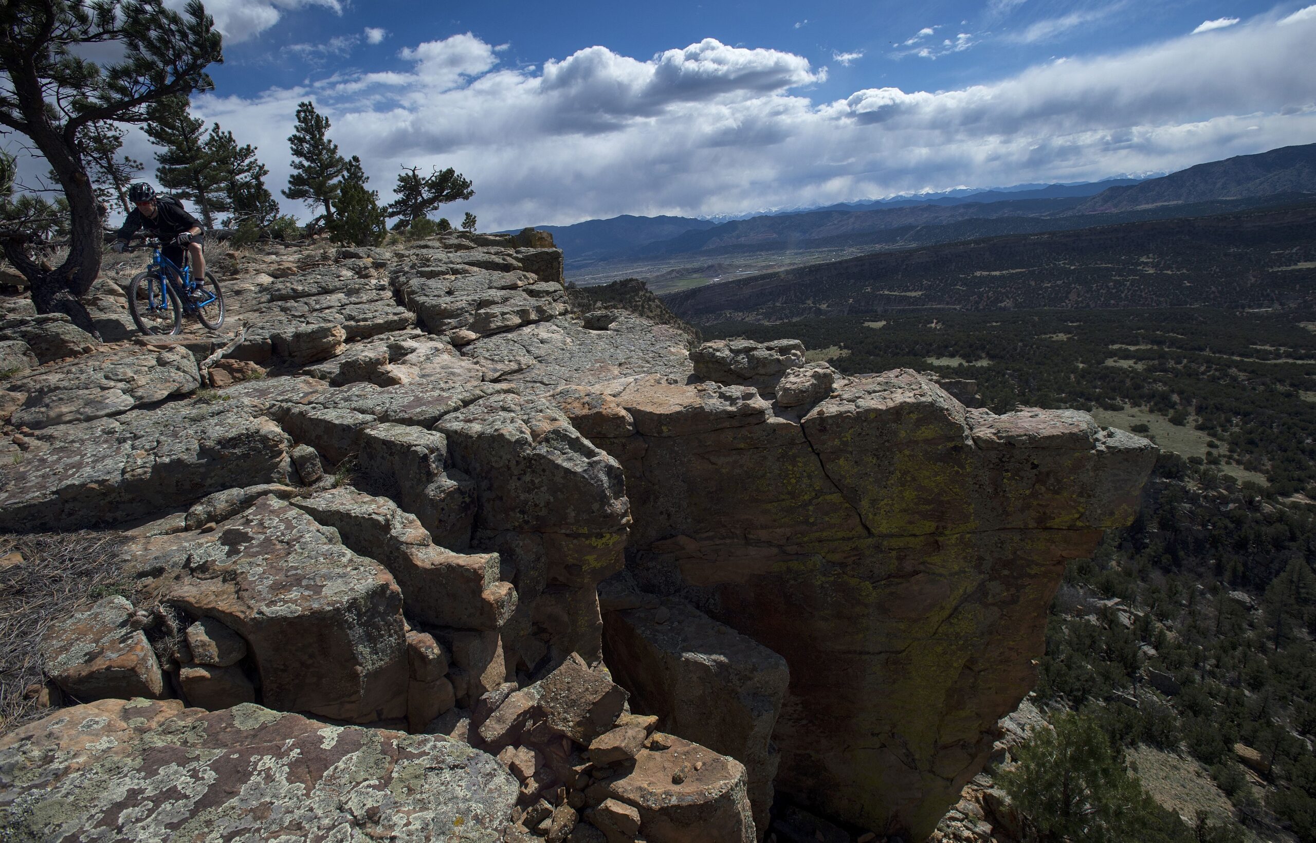 Scott Eckstrom of Canon City rides a trail Tuesday, April 29, 2014, on the 200-foot cliffs in the Oil Well Flats area north of Canon City. (The Gazette, Christian Murdock)