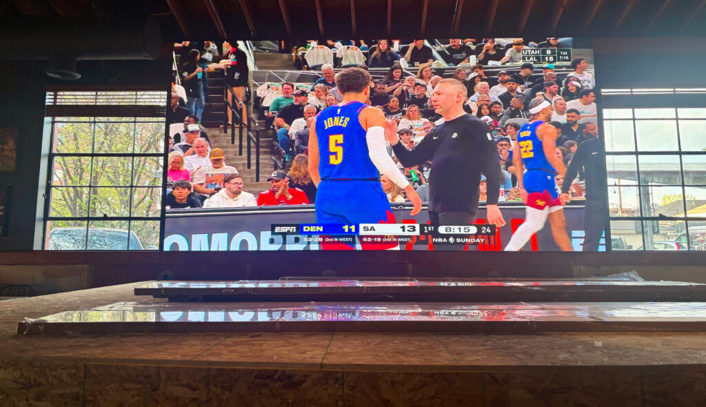 Chopper's Sports Grill installed a 21-foot TV screen for sporting events last year. It is also now building a stage to accommodate live concerts on non-game days. (John Moore/Denver Gazette)
