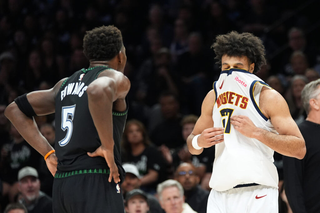 Denver Nuggets guard Jamal Murray (27), right, waits for play to resume during the first half in Game 3 of a first-round NBA basketball playoff series against the Minnesota Timberwolves, Thursday, April 23, 2026, in Minneapolis. (AP Photo/Abbie Parr)