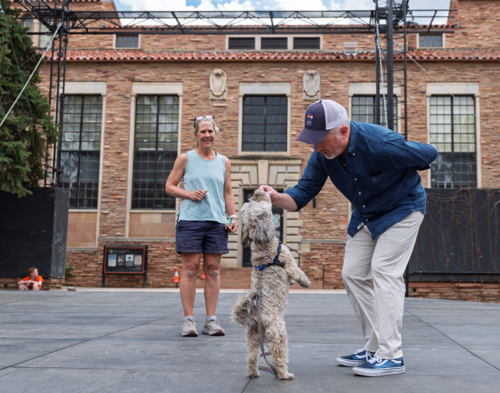 Colorado Shakespeare Festival Producing Artistic Director Timothy Orr sees how a dog responds to treats during auditions for two small dogs to share the role of "The Dog" in the 2026 production of “Shakespeare in Love” at the Mary Rippon Theatre on the CU Boulder campus. Photo taken March 28, 2026. (Glenn J. Asakawa/University of Colorado)