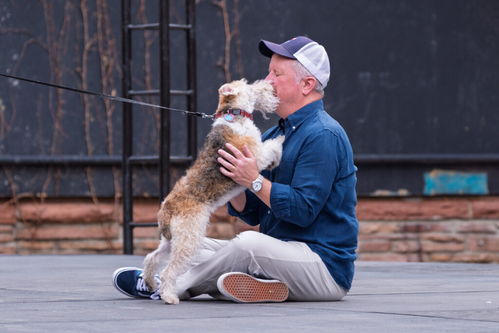 Colorado Shakespeare Festival Producing Artistic Director Timothy Orr gets up close and personal with an eager and friendly dog during auditions for two small dogs to share the role of "The Dog" in the 2026 production of “Shakespeare in Love” at the Mary Rippon Theatre on the CU Boulder campus. Photo taken March 28, 2026.