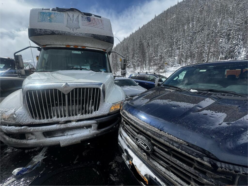 A photo of several vehicles after a crash