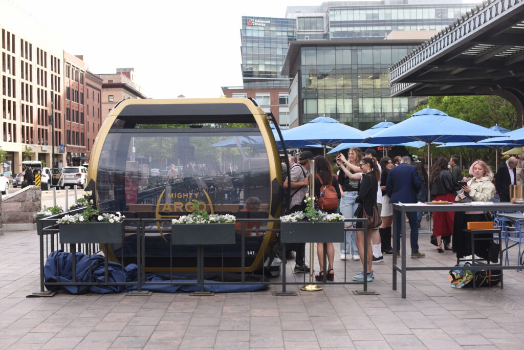 People walk inside a cable car