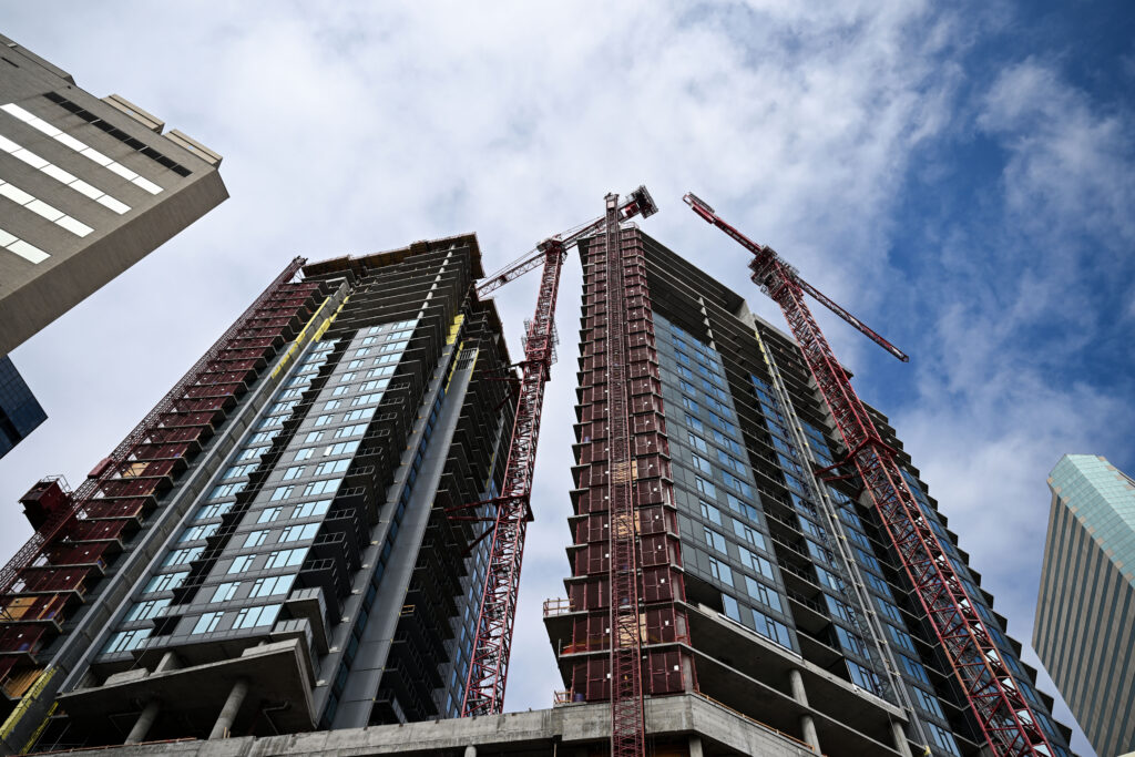 a vetical vuew of a downtown office building under construction