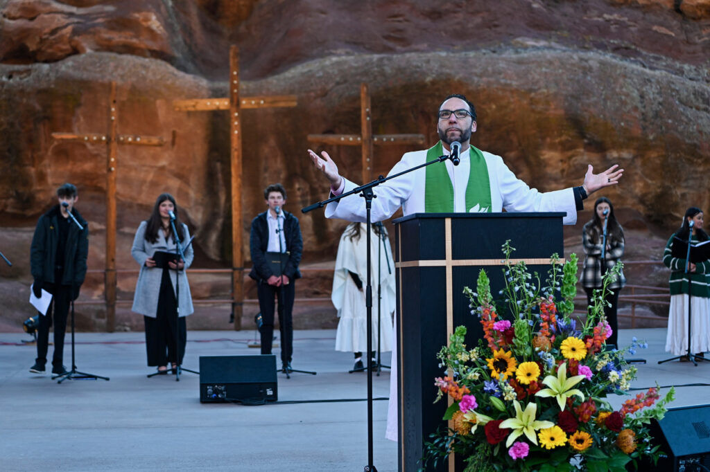 A man delivers a sermon at a podium