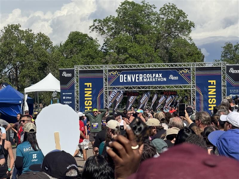 People run through a finish line