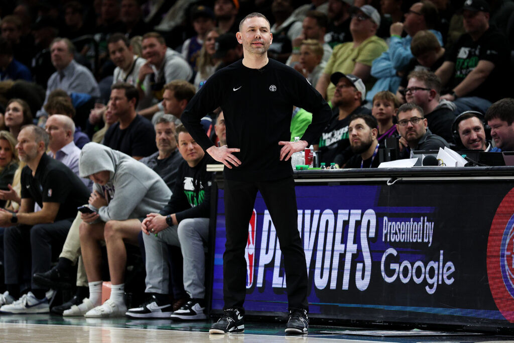 Denver Nuggets head coach David Adelman, center, looks on during the first half of Game 6 of a first-round NBA basketball playoffs series against the Minnesota Timberwolves, Thursday, April 30, 2026, in Minneapolis. (AP Photo/Matt Krohn)