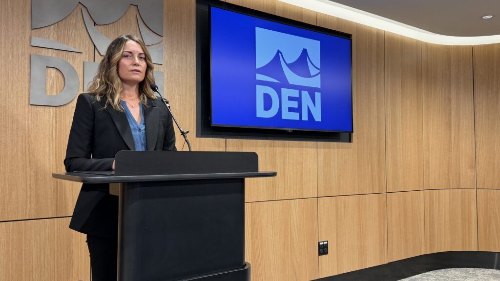 a woman standing behind a podium