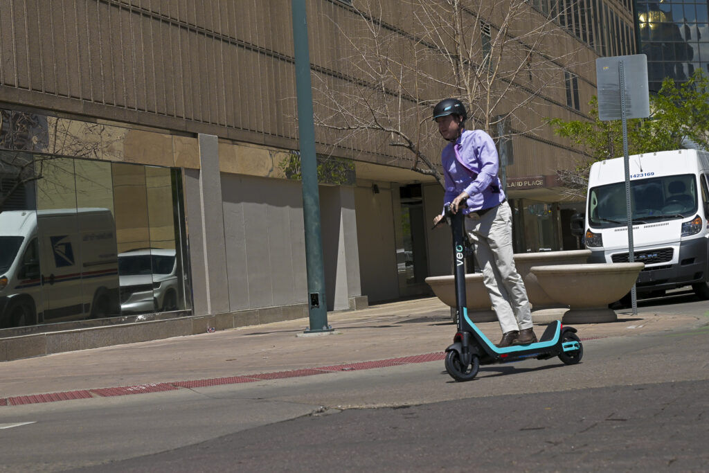 a man riding an electric scooter