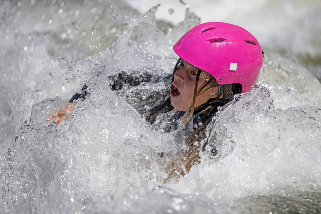 Ivy Selby rides the waves at the Buena Vista River Park on the Arkansas River in Buena Vista on Saturday, May 29, 2026. (The Gazette, Michael G. Seamans)