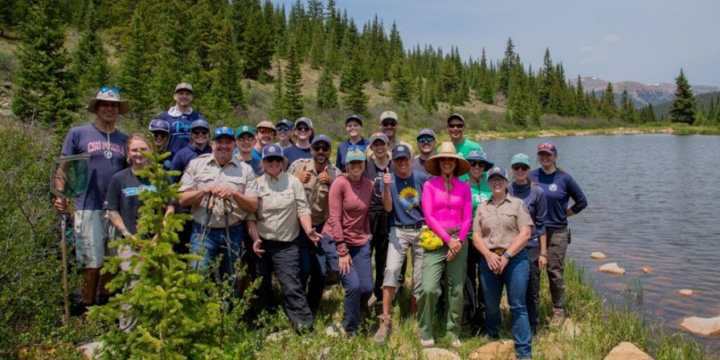 Staff from Colorado Parks and Wildlife and the Denver Zoo Conservation Alliance hiked miles to alpine ponds, carrying 10 pounds of boreal toad tadpoles on their backs to release them into the wild. Photo: Colorado Parks and Wildlife.