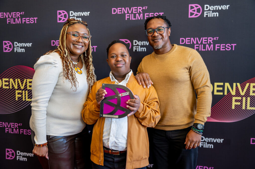 Aurora actor Jeremiah Daniels, center, with parents Joi and Terrance Daniels at the 2024 Denver Film Festival. (Beau Ngu/Denver Film)