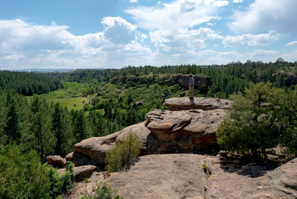 Justin Spring, state director of The Conservation Fund, stands at the end of a cliff at Castle Rock’s newest and largest-ever open space acquisition, Lost Canyon Ranch. Gazette file