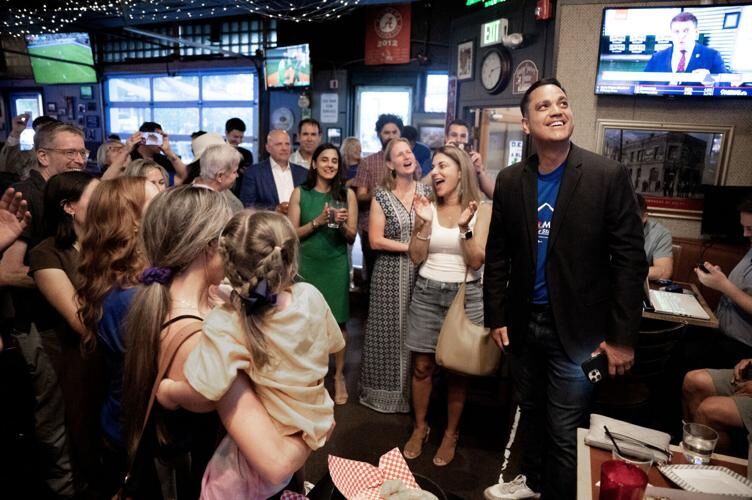 Sean Camacho watches his lead widen at a watch party for Camacho, who is running for Democratic nomination for House District 6, at College Inn in Denver on Tuesday, June 25, 2024. “Denver made a statement tonight,” Camacho said in his acceptance speech. (Stephen Swofford, Denver Gazette)