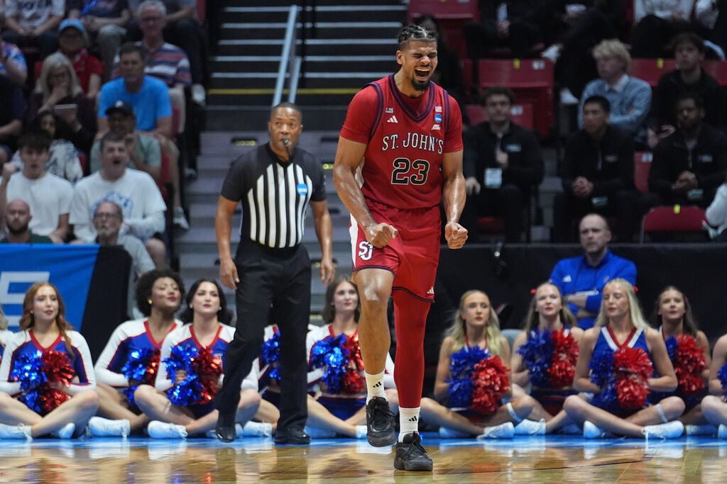 St. John's forward Bryce Hopkins (23) celebrates after a play against Kansas during the second half of a game in the second round of the NCAA college basketball tournament Sunday, March 22, 2026, in San Diego. (AP Photo/Marcio Jose Sanchez)
