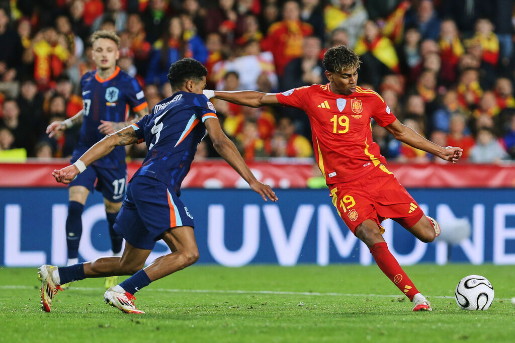 FILE - Spain's Lamine Yamal, right, scores his side third goal during the UEFA Nations League quarterfinal second leg match between the Netherlands and Spain at Mestalla stadium in Valencia, Spain, Sunday, March 23, 2025. (AP Photo/Alberto Saiz, File)
