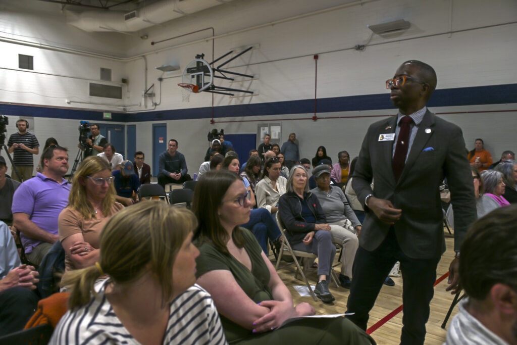 a man speaking to a crowd