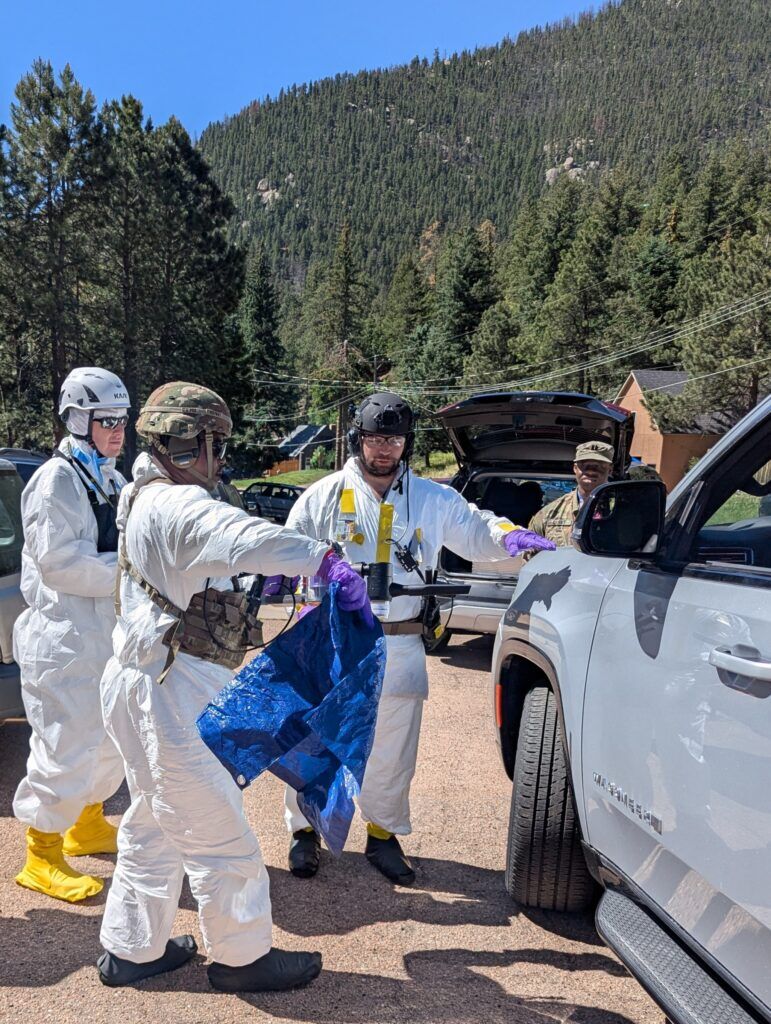 Trainees transporting fake radioactive substances into a vehicle (Courtesy of the FBI).