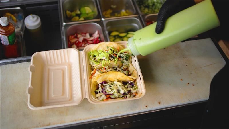 Tacos are dressed for serving at the 2025 Aurora Fest.