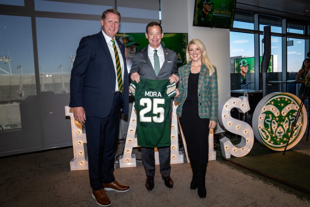 Colorado State athletic director John Weber, left, and university president Amy Parsons, right, pose with new football coach Jim Mora, middle, at an introductory press conference on Dec. 1, 2025 at Canvas Stadium in Fort Collins. (Courtesy of CSU Athletics)