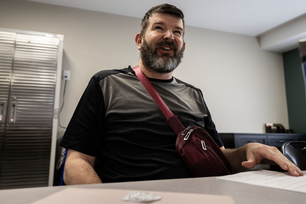 Nate works on a scrapbook during a class at the Wellspring Community in Castle Rock on Thursday, June 4, 2026. The Wellspring Community aims to help adults with intellectual and developmental disabilities live more satisfying, independent lives.