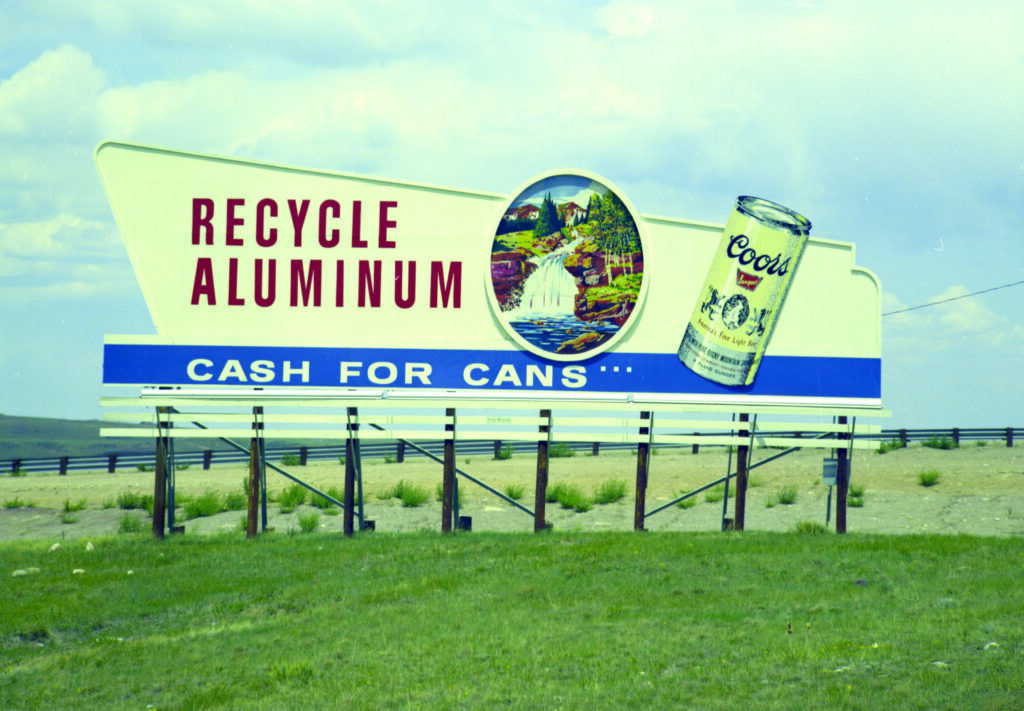 A historic Coors Brewing Company billboard urging customers to recycle cans