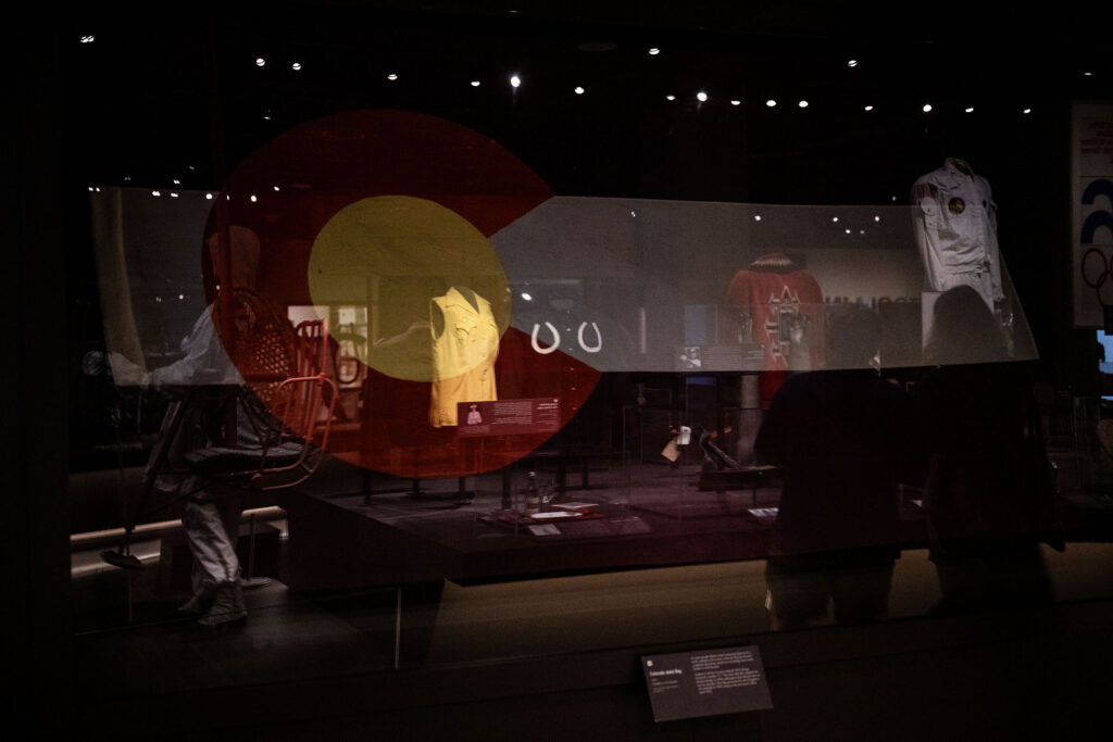 historical Colorado items on display behind glass cases at History Colorado