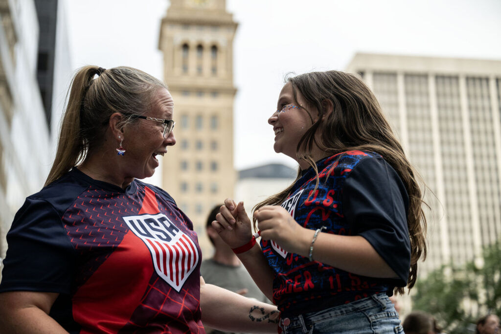 Jill Jones and her daughter, Harper, 10, celebrate a USA goal during a watch party for the USA vs Bosnia-Herzegovina game at Skyline Park on Wednesday, July 1, 2026.