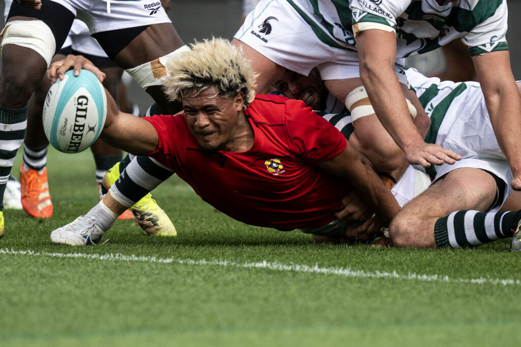 Tonga Inside Center Fine Inisi scores a try as he’s tackled by Zimbabwe players near the line in the first half of Tonga vs Zimbabwe at the Rugby World Nations Cup at Dicks Sporting Goods Park on Saturday, July 4, 2026. Tonga won 36-24.