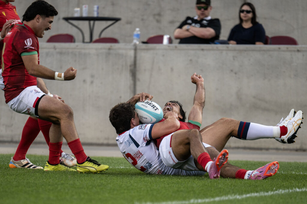 Portugal Winger Manuel Cardoso Pinto celebrates as he scores the first try of the match as USA tries to hold him up during the USA vs Portugal game at the Rugby World Nations Cup at Dicks Sporting Goods Park on Saturday, July 4, 2026.