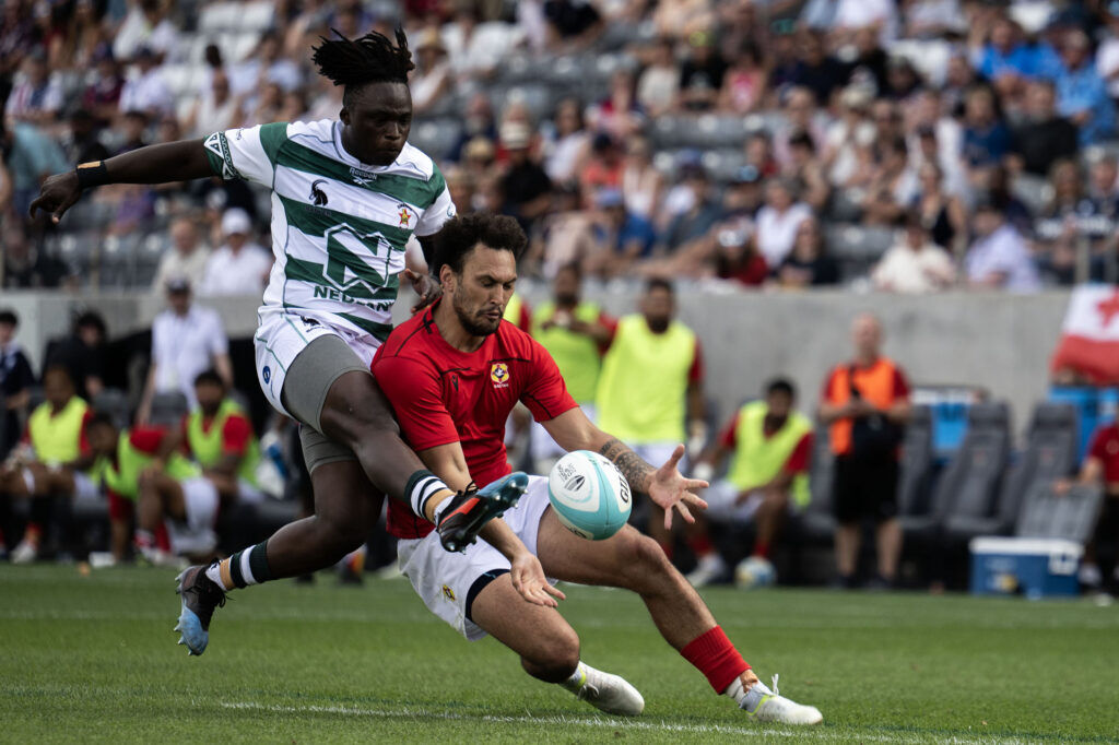 Zimbabwe Winger fights over the ball with Tonga Fullback Trevor Gurwe during the first half of Tonga vs Zimbabwe at the Rugby World Nations Cup at Dicks Sporting Goods Park on Saturday, July 4, 2026. Tonga won 36-24.