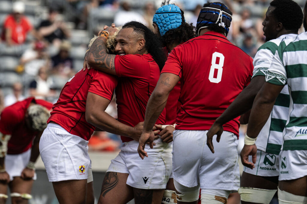 Tonga Outside Center Fine Inisi celebrates with his teammates after scoring a try during the first half of Tonga vs Zimbabwe at the Rugby World Nations Cup at Dicks Sporting Goods Park on Saturday, July 4, 2026. Tonga won 36-24.