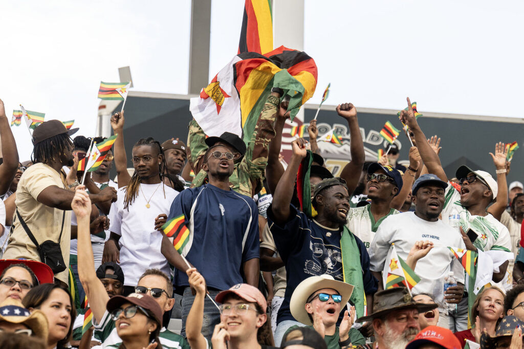 Zimbabwe fans celebrate in the stands as Zimbabwe scores a try during the second half of Tonga vs Zimbabwe at the Rugby World Nations Cup at Dicks Sporting Goods Park on Saturday, July 4, 2026. Tonga won 36-24.
