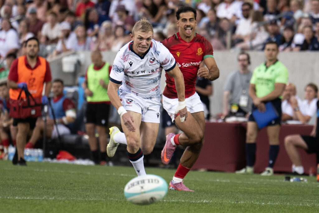 USA Full Back Mitch Wilson and Portugal Winger Manuel Cardoso Pinto chase down the ball near the Portugal try zone during the first half of the USA vs Portugal game at the Rugby World Nations Cup at Dicks Sporting Goods Park on Saturday, July 4, 2026. USA won the match 30-29.