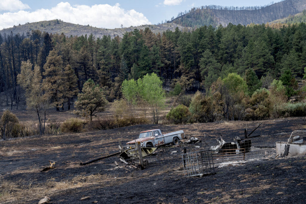 A car destroyed by the Aspen Acres Fire sits in the black burn of a field in Beulah on Friday, July 10, 2026. (The Gazette, Michael G. Seamans)