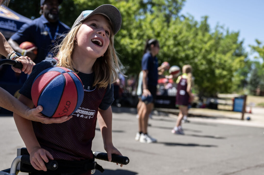 Elliott Gibbs, 7, shoots some hoops during a Youth Sports Day clinic for special olympics young athletes on Friday, July 10, 2026. Athletes learned basketball, street hockey, soccer, lacrosse, and dance during the event.