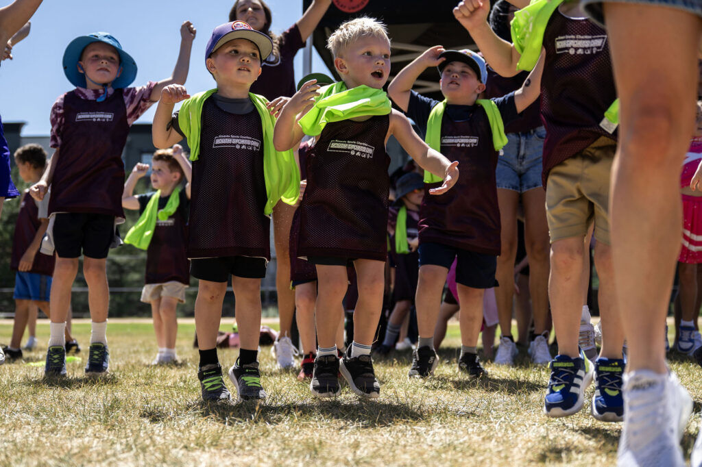 Kids warm up before the start of a Youth Sports Day clinic for special olympics young athletes on Friday, July 10, 2026. Athletes learned basketball, street hockey, soccer, lacrosse, and dance during the event.
