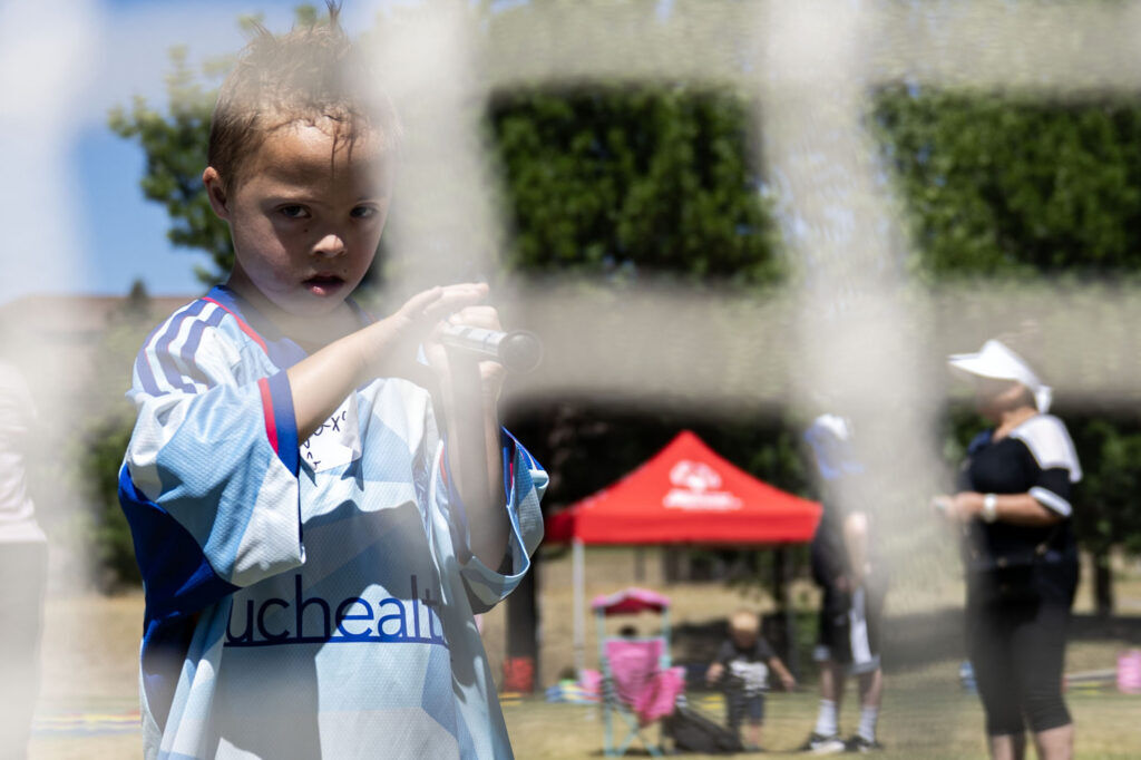 Jaxson Leeper, 7, takes a shot at the goal as he learns how to play lacrosse during a Youth Sports Day clinic for special olympics young athletes on Friday, July 10, 2026. Athletes learned basketball, street hockey, soccer, lacrosse, and dance during the event.